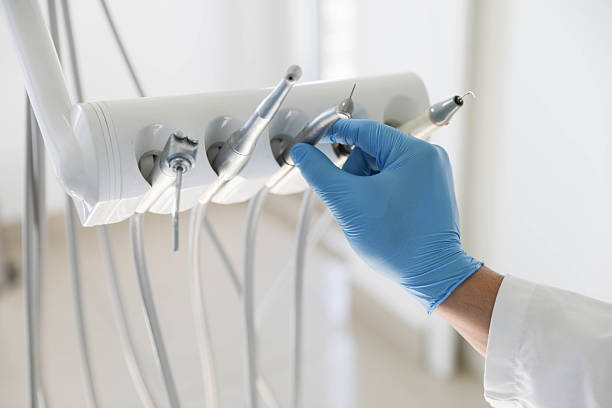 Professional Tooth Extraction technician working in Lafayette, CO